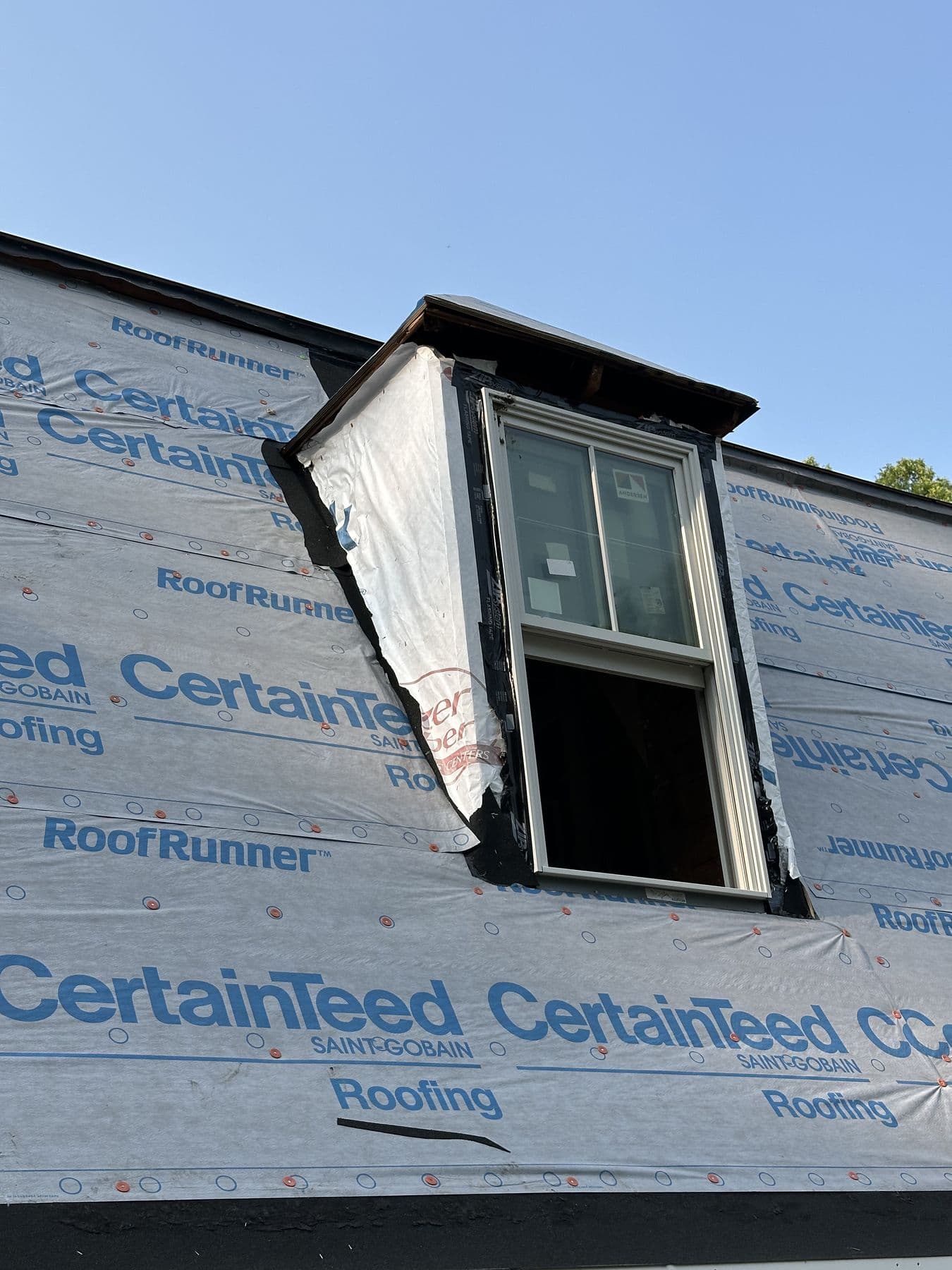 Dormer with the window set and sides wrapped, seen from the roof