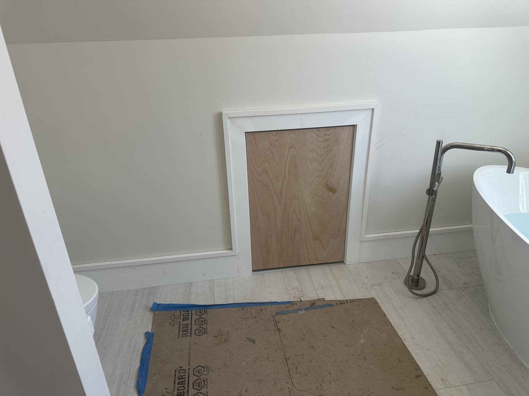 Bathroom with a freestanding tub, new panel trim and baseboard